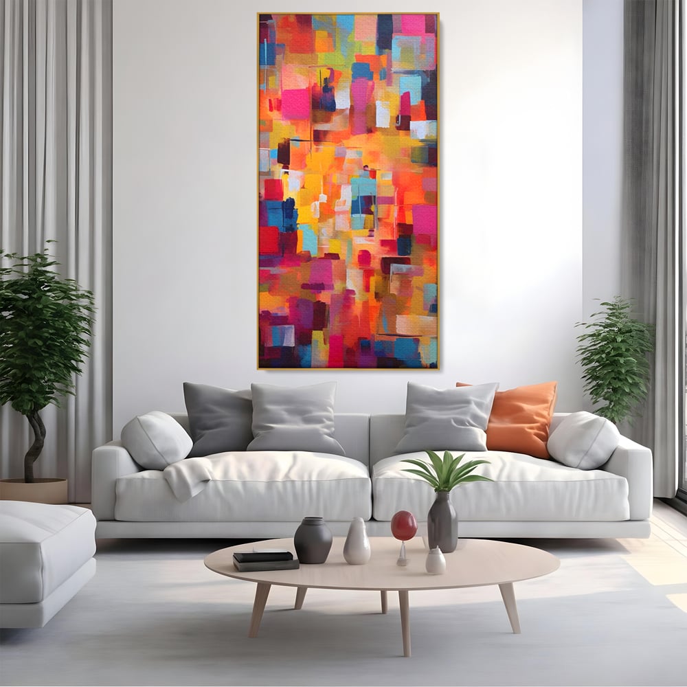 Tablou canvas cu pictura abstracta cu blocuri de culoare, in rama de aluminiu auriu, pe perete intr-un living